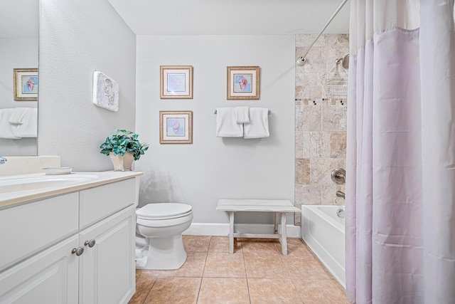 full bathroom featuring toilet, shower / bath combo, vanity, baseboards, and tile patterned floors