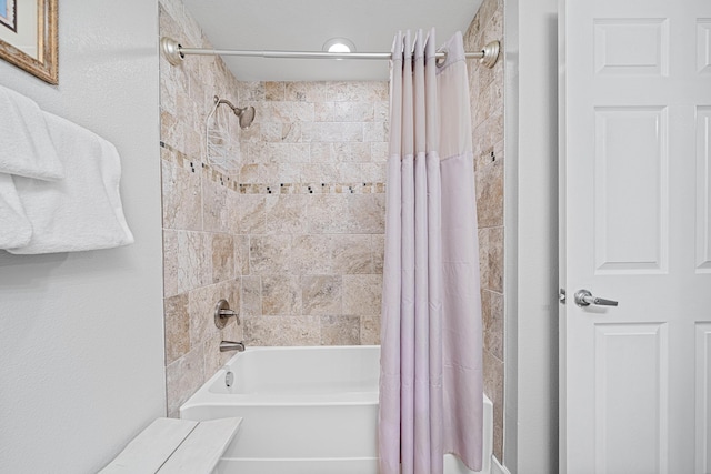 bathroom with shower / bathtub combination with curtain