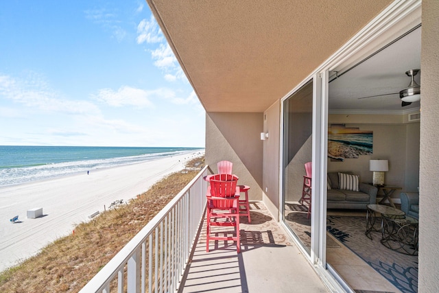 balcony with a beach view and a water view