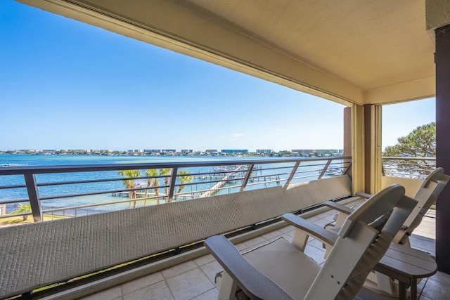 balcony featuring a view of city and a water view