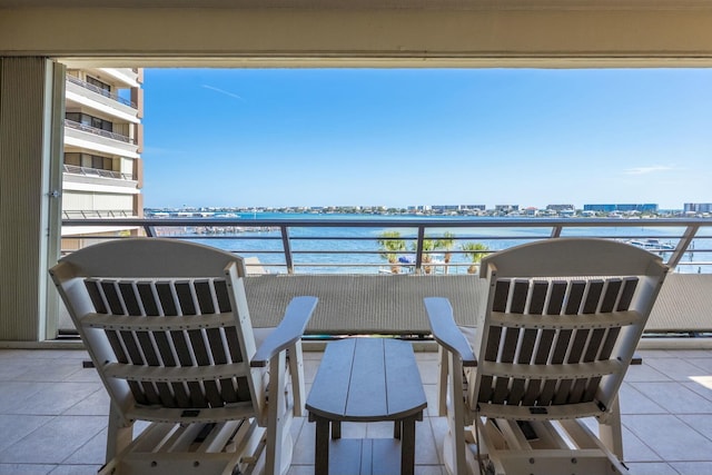 balcony with a view of city and a water view