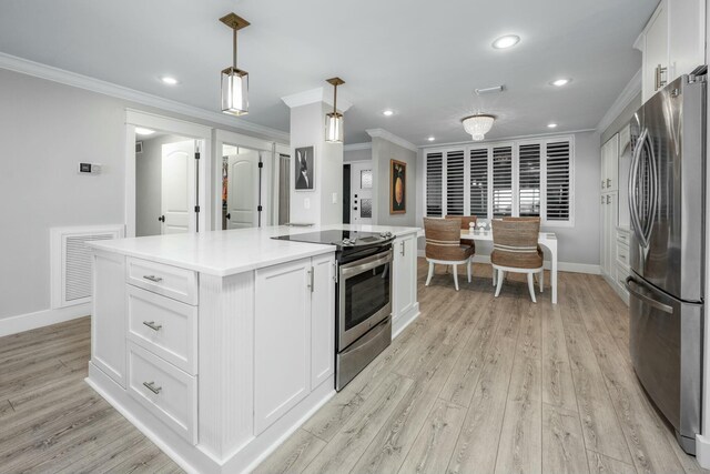 kitchen featuring white cabinetry, light wood-style flooring, visible vents, and stainless steel appliances