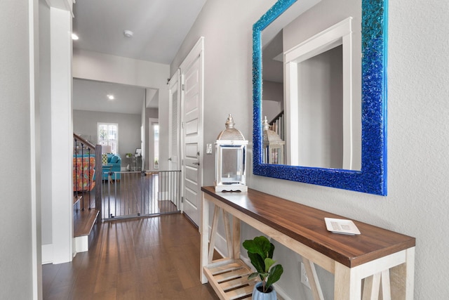 corridor featuring stairway and wood finished floors