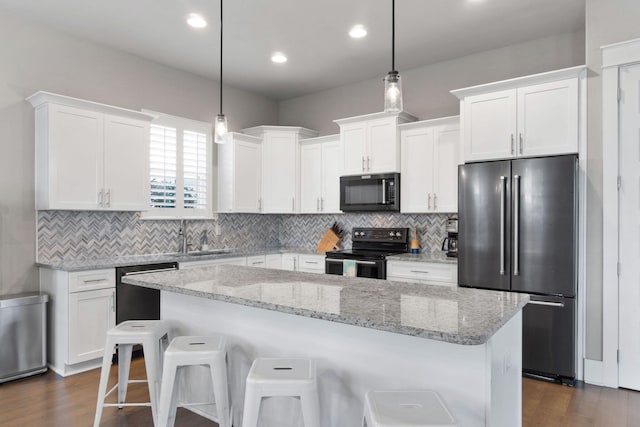 kitchen with dishwashing machine, white cabinets, black range with electric stovetop, and high end refrigerator