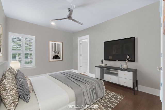 bedroom with a ceiling fan, baseboards, and wood finished floors