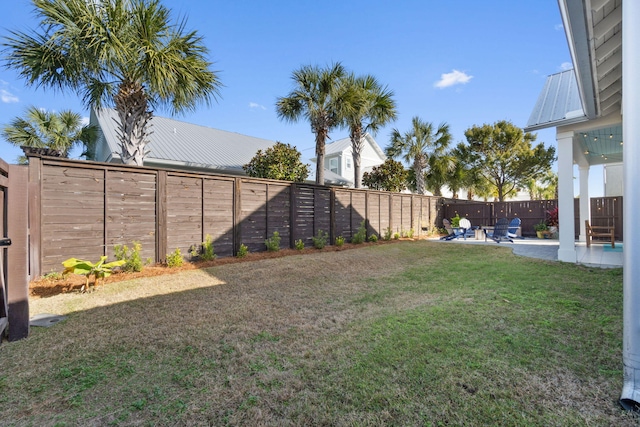 view of yard with a patio and a fenced backyard