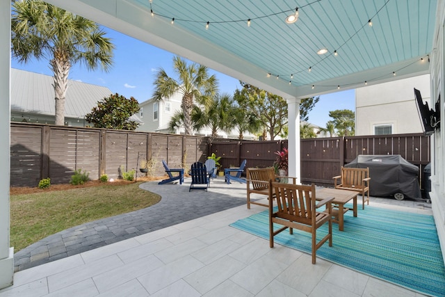 view of patio with a fenced backyard and grilling area