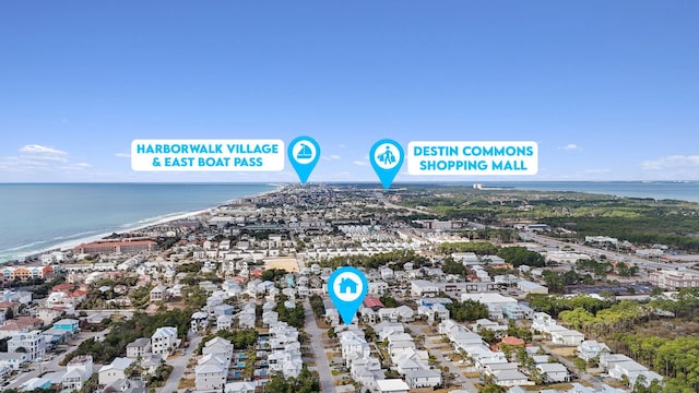 birds eye view of property featuring a water view and a beach view