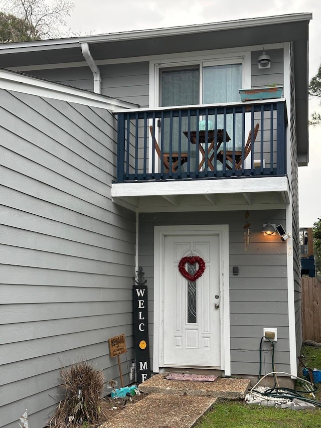 property entrance with a balcony