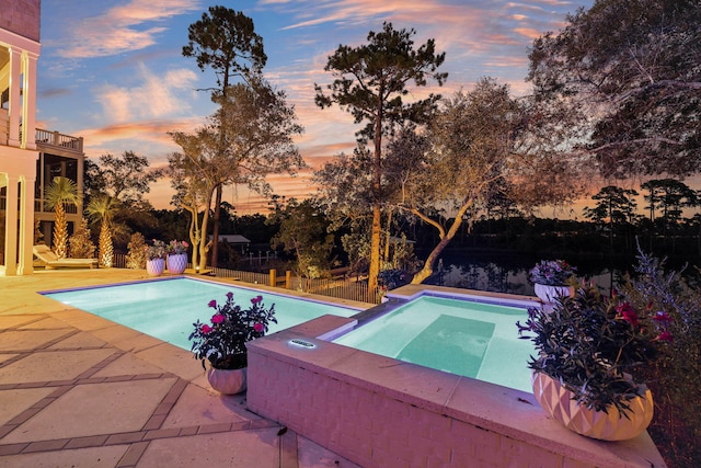 pool featuring a fenced backyard and a patio area