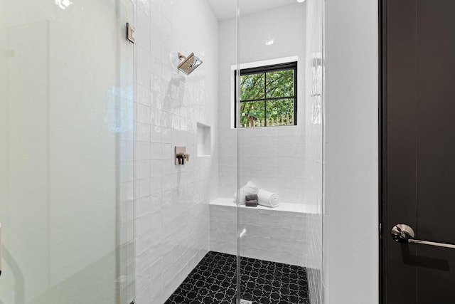 bathroom with a shower stall