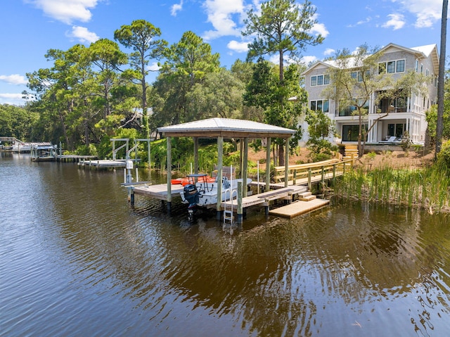 view of dock with boat lift and a water view