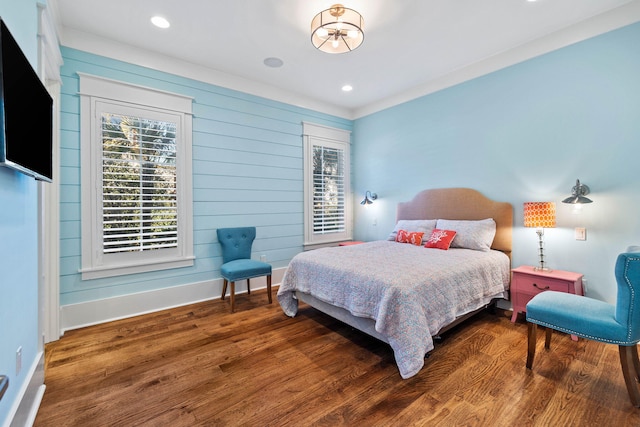 bedroom with recessed lighting, baseboards, and wood finished floors