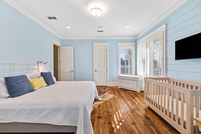 bedroom featuring recessed lighting, visible vents, and wood finished floors