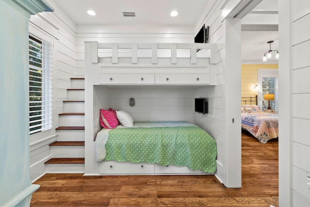 bedroom with wood finished floors, visible vents, and recessed lighting