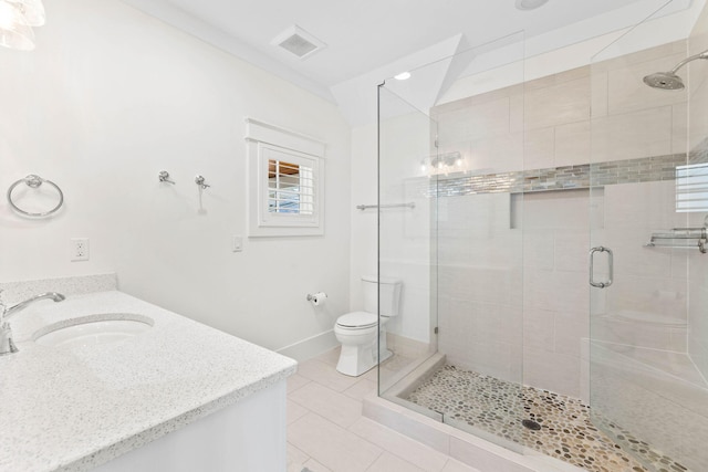 full bathroom featuring lofted ceiling, tile patterned flooring, toilet, vanity, and a stall shower