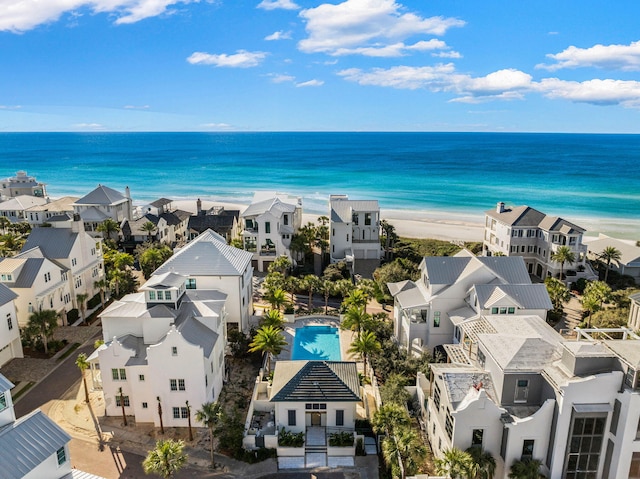 drone / aerial view featuring a view of the beach and a water view