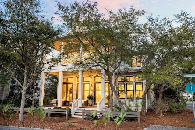 back of house with covered porch