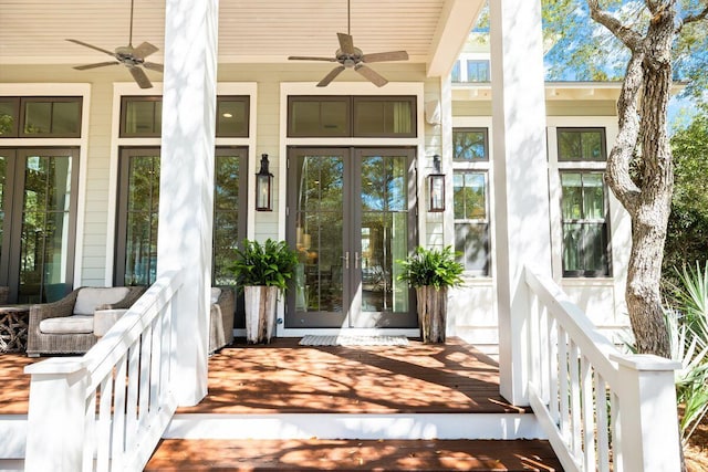 view of exterior entry with french doors and ceiling fan