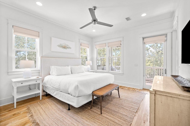 bedroom featuring visible vents, ornamental molding, wood finished floors, baseboards, and access to exterior