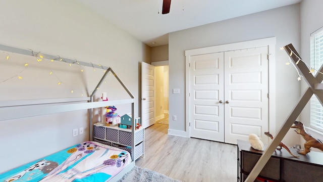 recreation room with ceiling fan, wood finished floors, and baseboards