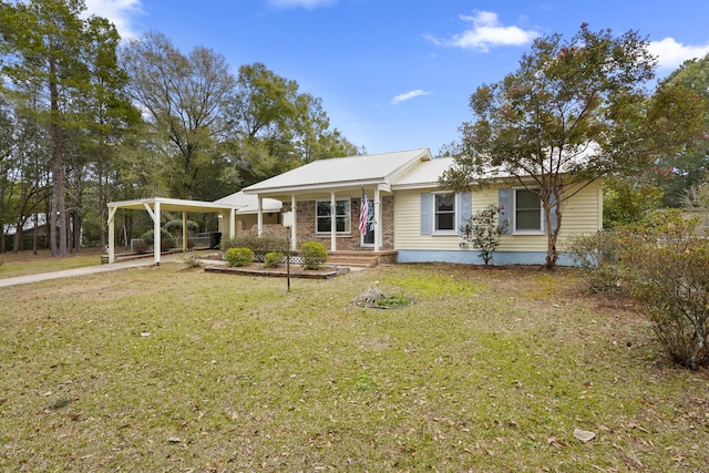 view of front of property featuring brick siding, metal roof, and a front lawn