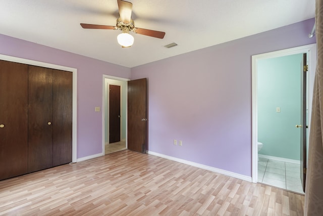 unfurnished bedroom featuring light wood-style floors and baseboards