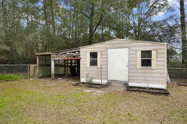 view of shed featuring fence