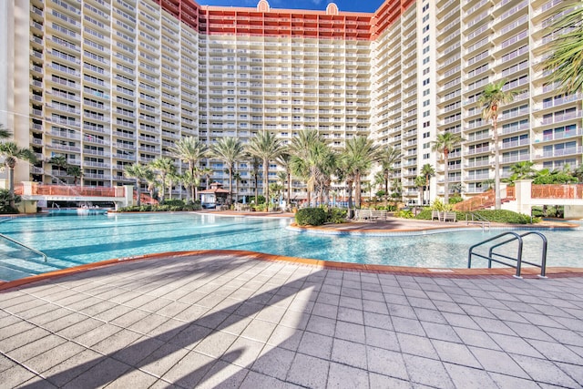 view of swimming pool with a patio area