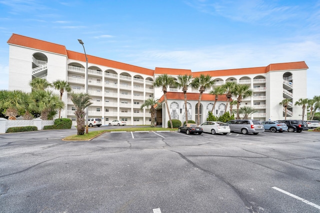 view of property with uncovered parking