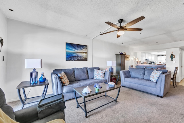 909 Santa Rosa Blvd Unit 537, Fort Walton Beach, FL 32548 - living room featuring a textured ceiling, light carpet, and ceiling fan