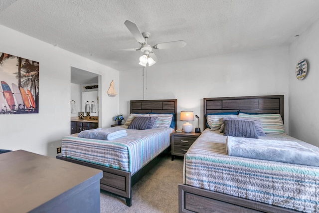 909 Santa Rosa Blvd Unit 537, Fort Walton Beach, FL 32548 - bedroom featuring ceiling fan, ensuite bath, carpet, and a textured ceiling