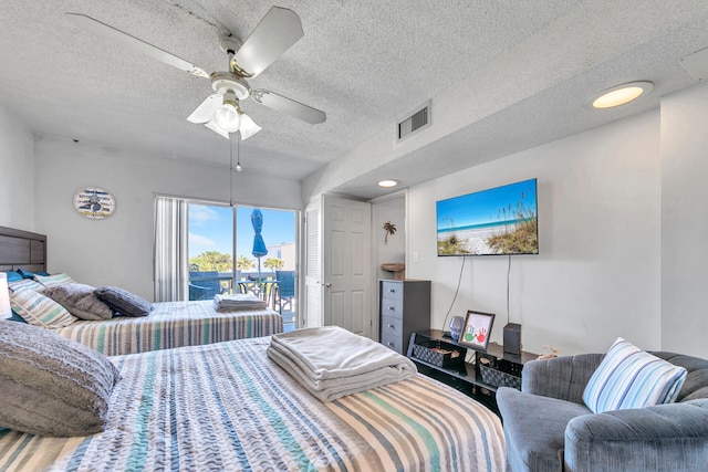 909 Santa Rosa Blvd Unit 537, Fort Walton Beach, FL 32548 - bedroom featuring visible vents, a textured ceiling, a ceiling fan, and access to outside