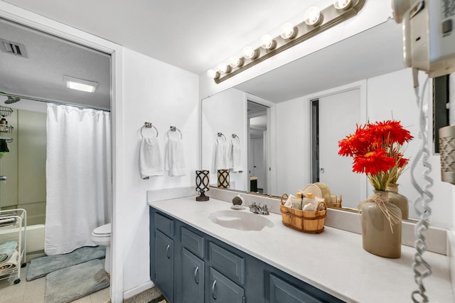 909 Santa Rosa Blvd Unit 537, Fort Walton Beach, FL 32548 - bathroom featuring vanity, visible vents, shower / bath combo, tile patterned floors, and toilet
