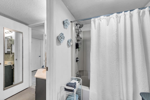 909 Santa Rosa Blvd Unit 537, Fort Walton Beach, FL 32548 - full bath with tile patterned floors, shower / bath combination with curtain, a textured ceiling, and vanity