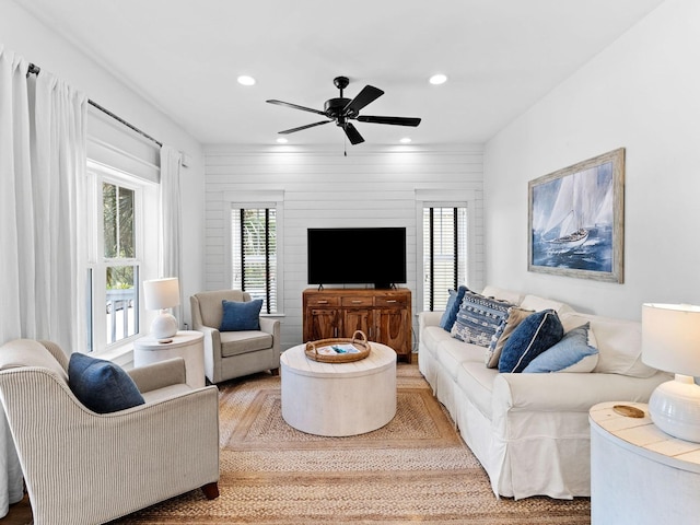 living area featuring recessed lighting and ceiling fan