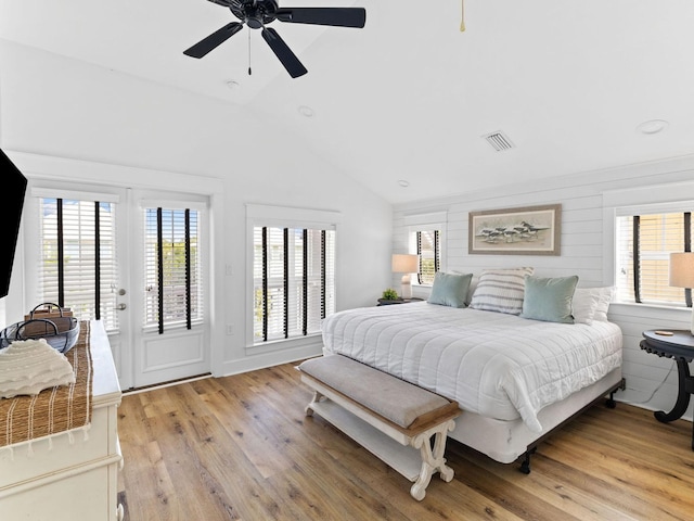 bedroom with visible vents, ceiling fan, vaulted ceiling, light wood-style flooring, and access to outside