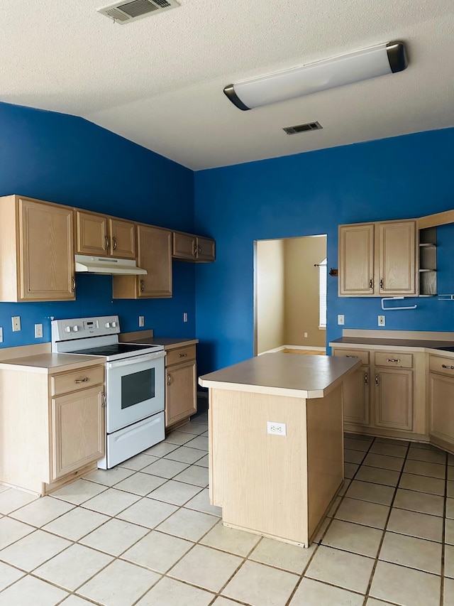 kitchen with visible vents, under cabinet range hood, light brown cabinetry, light tile patterned floors, and white electric range