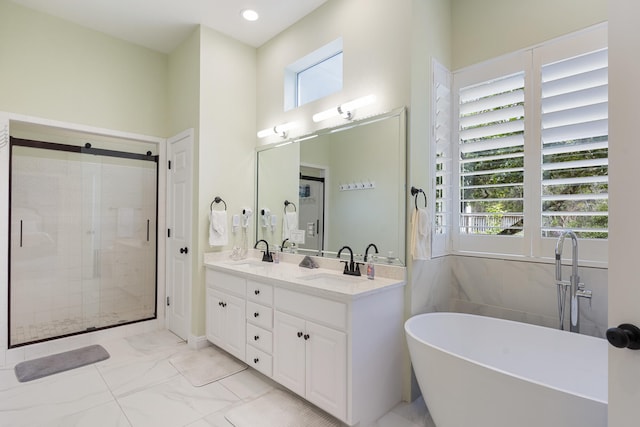 75 Sierra Dunes Dr, Miramar Beach, FL 32550 - bathroom with a wealth of natural light, marble finish floor, a freestanding bath, and a shower stall