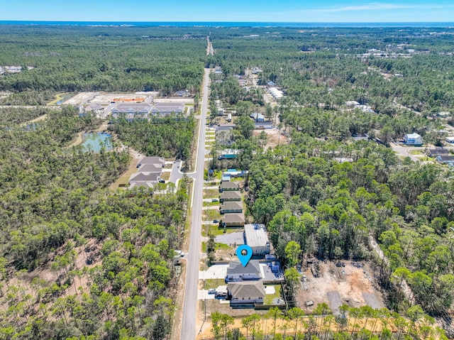 bird's eye view featuring a forest view