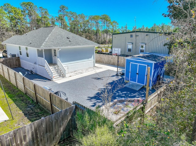 view of shed featuring a fenced backyard