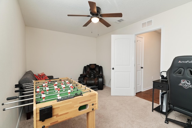 playroom with visible vents, carpet flooring, baseboards, and a ceiling fan