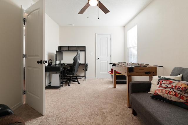 playroom with baseboards, a ceiling fan, and carpet floors