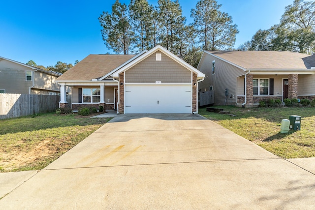 view of front of house featuring an attached garage, concrete driveway, a front lawn, and fence