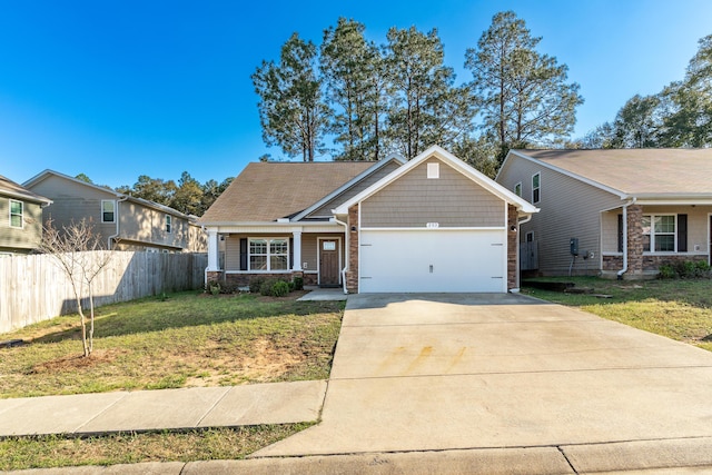 view of front of property featuring an attached garage, concrete driveway, a front lawn, and fence