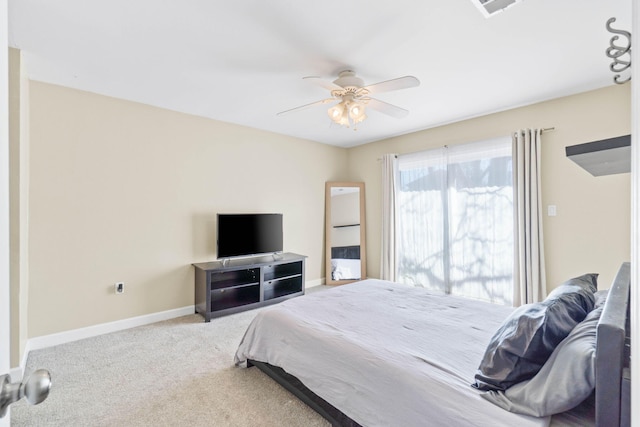 bedroom featuring a ceiling fan, carpet flooring, visible vents, and baseboards