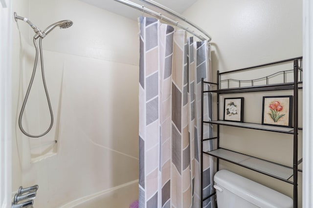 bathroom with toilet and shower / bath combo with shower curtain