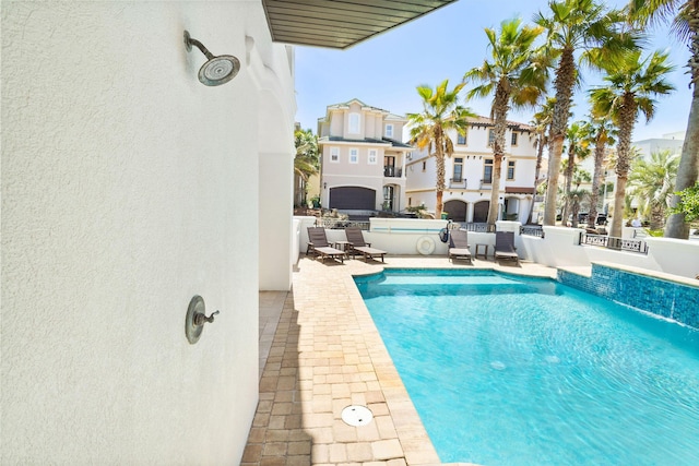 view of swimming pool with a fenced in pool, a patio area, and fence