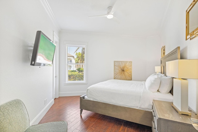 bedroom featuring dark wood-style floors, baseboards, ornamental molding, and ceiling fan