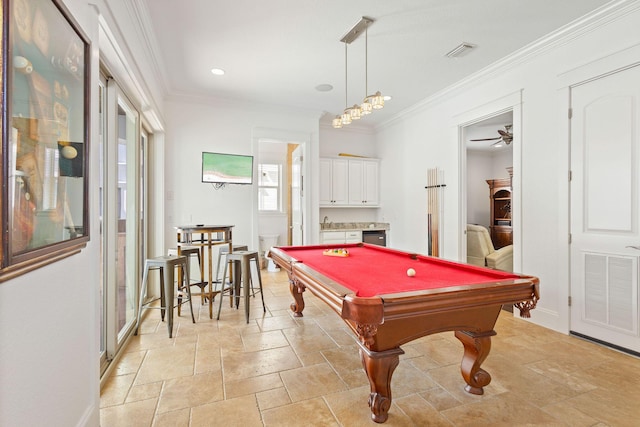 recreation room with ornamental molding, stone tile flooring, visible vents, and billiards